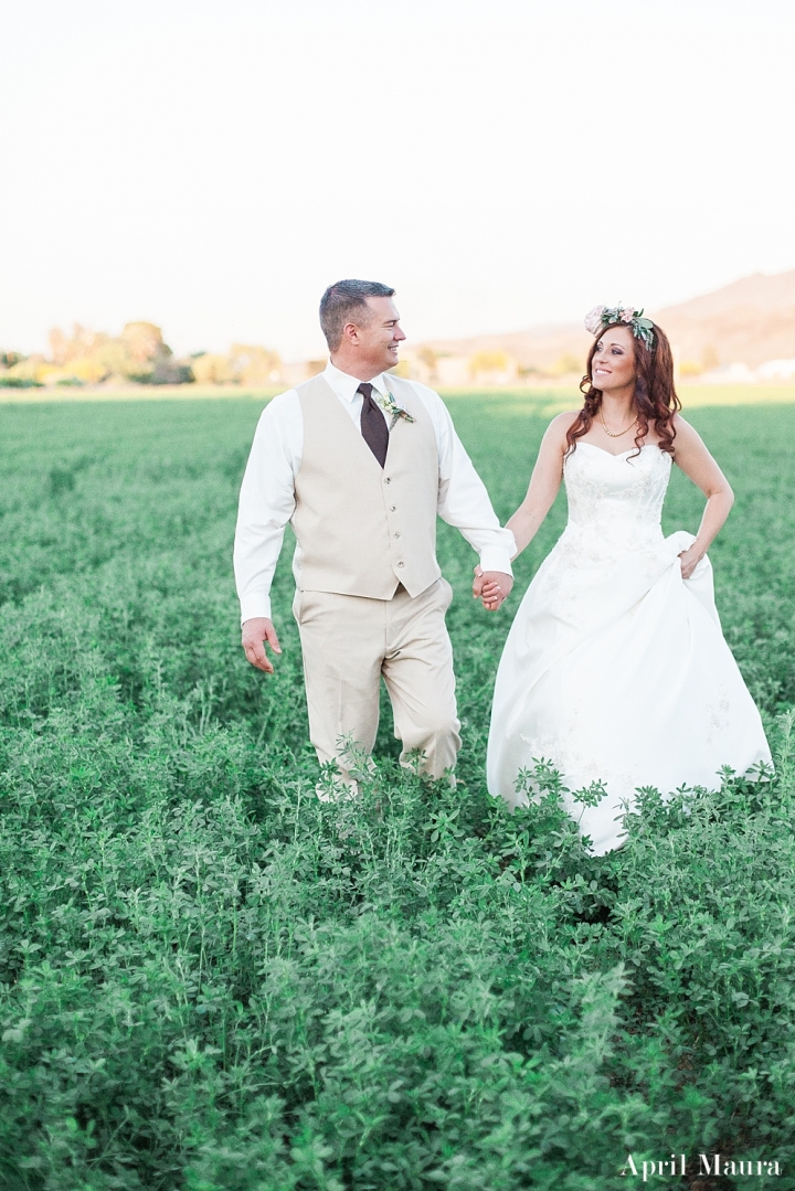bride and groom looking at each other in a field | The_Whispering_Tree_Ranch_Arizona_Wedding_April_Maura_Photography_0060.jpg