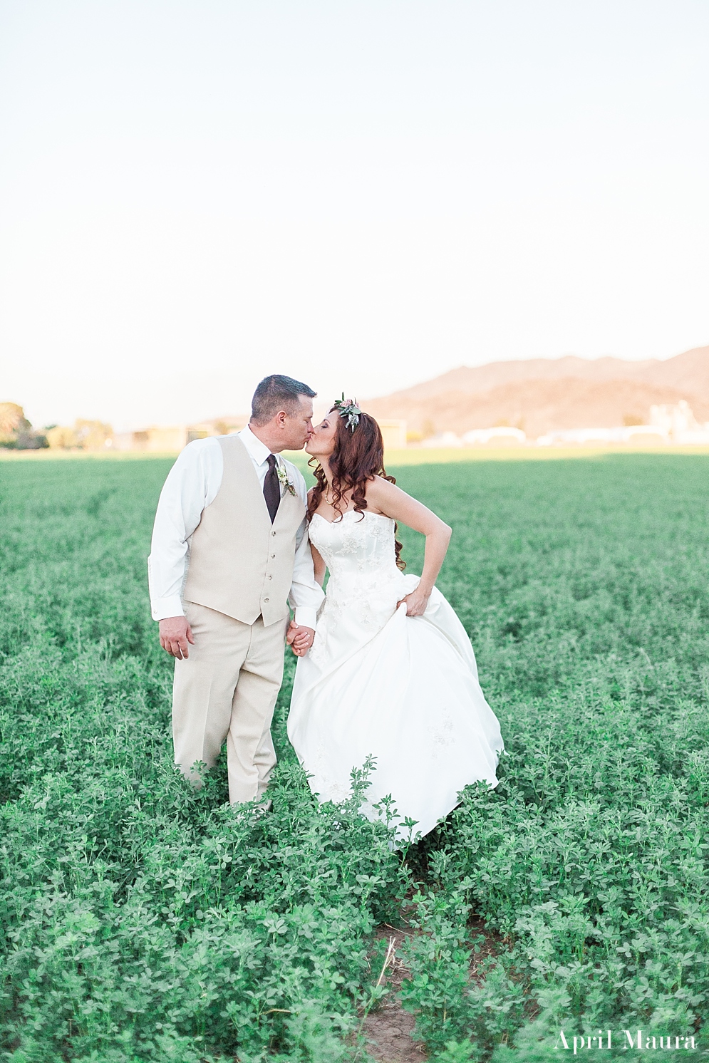 bride and groom kissing in a green field | The_Whispering_Tree_Ranch_Arizona_Wedding_April_Maura_Photography_0061.jpg