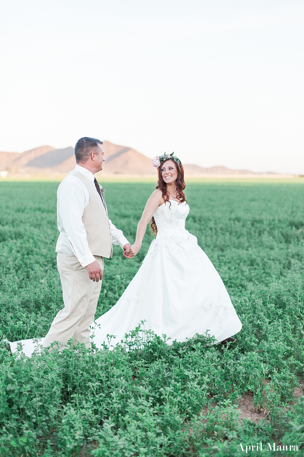 bride and groom walking in a green field | The_Whispering_Tree_Ranch_Arizona_Wedding_April_Maura_Photography_0062.jpg