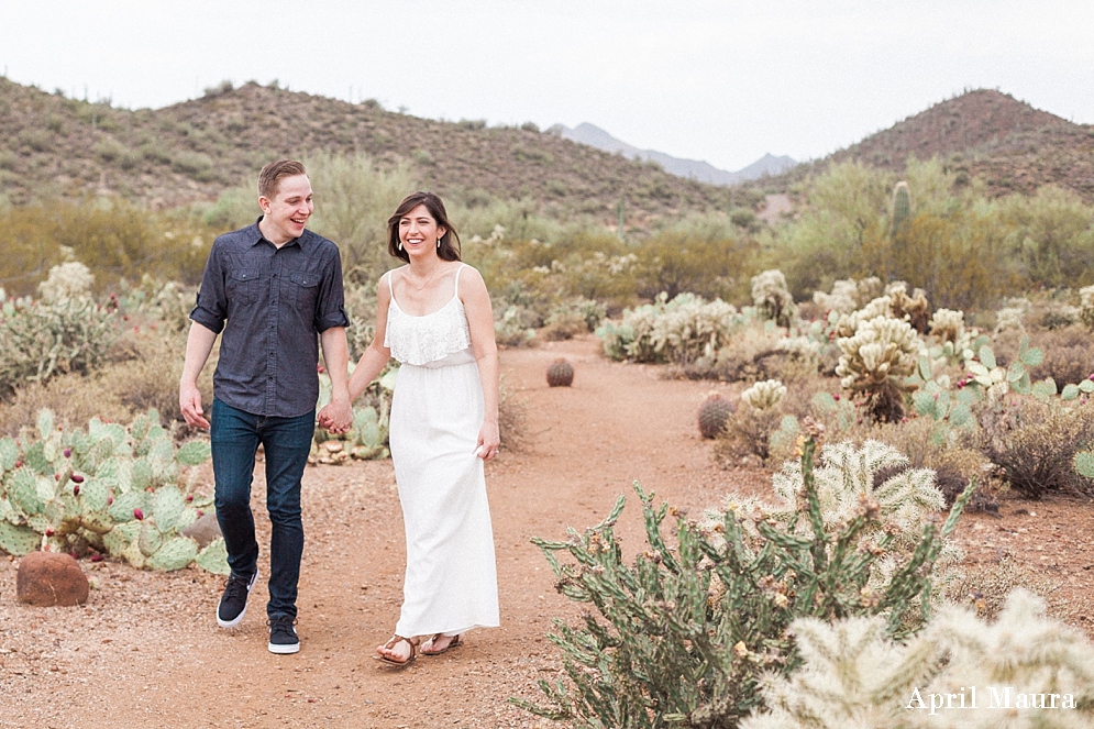 engaged couple walking in the Phoenix desert | Cave Creek engagement session | Phoenix engagement photographer_0020.jpg