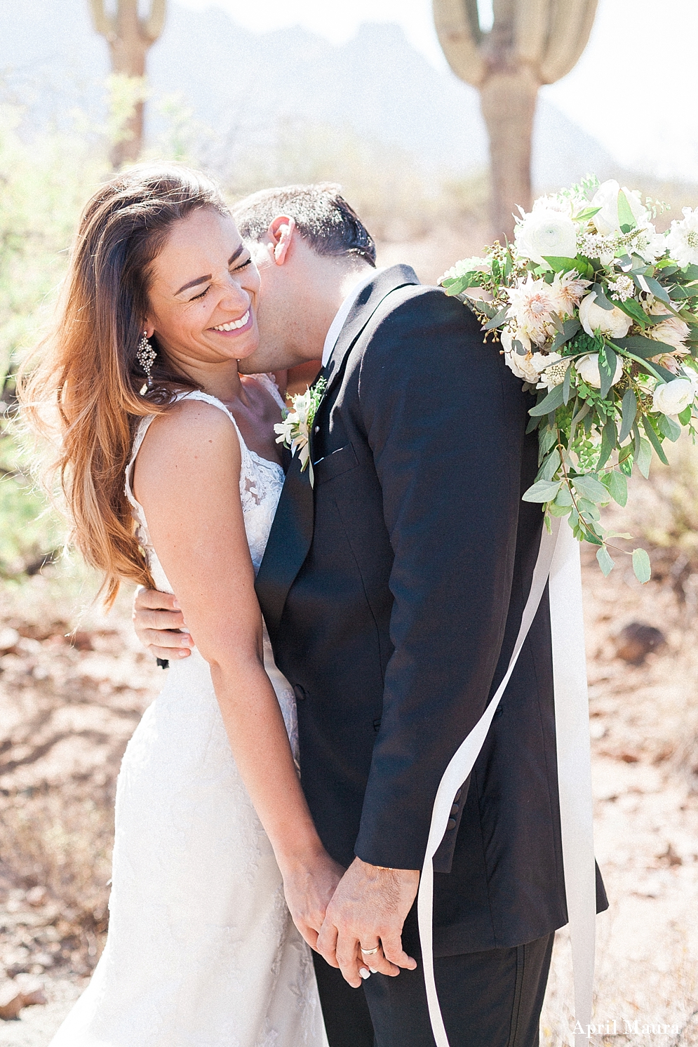 Bride laughing when her husband kisses her | white bouquet | The Paseo Wedding | Scottsdale Engagement Photographer | April Maura Photography | www.aprilmaura.com_3679.jpg