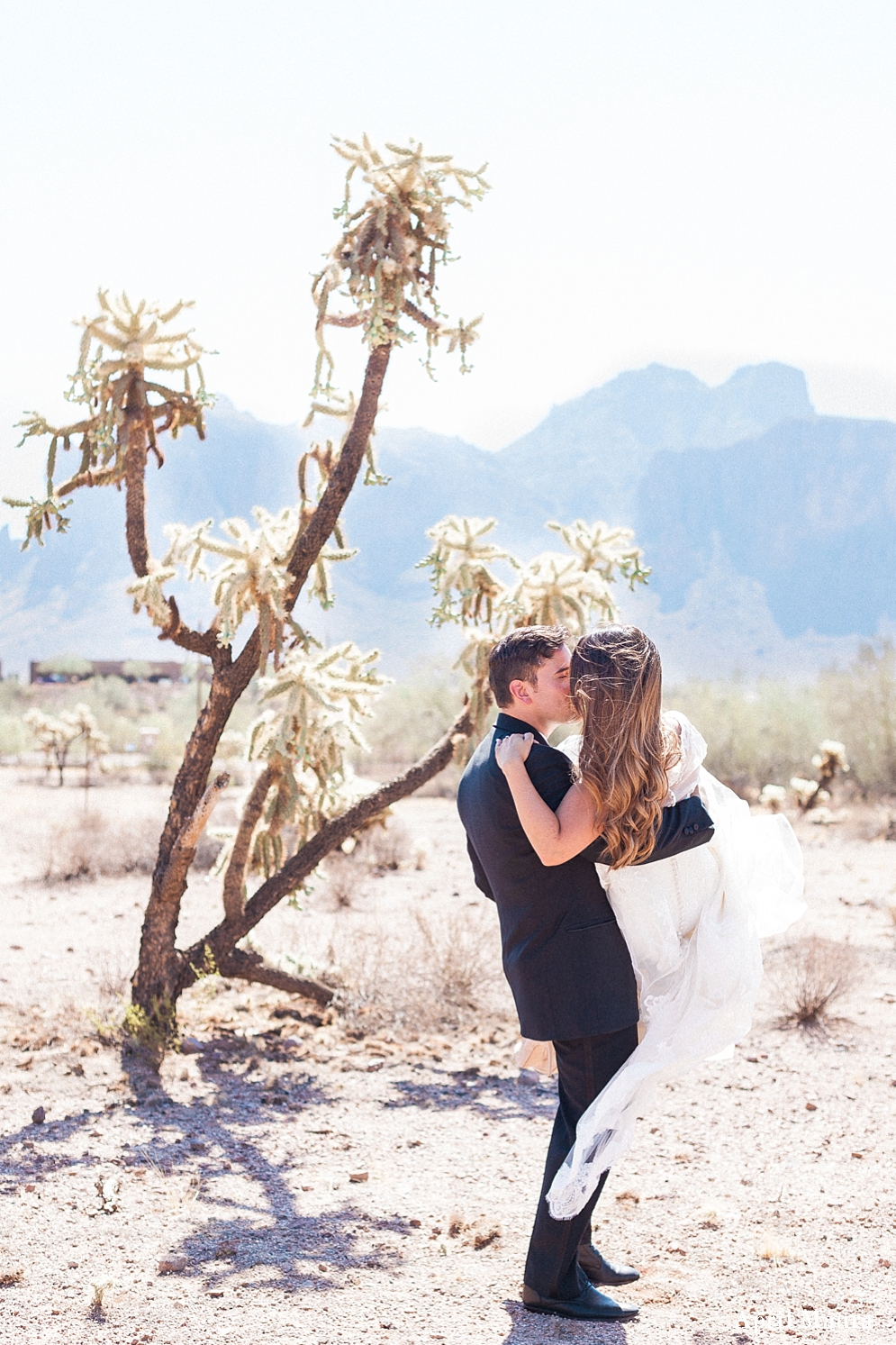 Princess carry of a bride on her wedding day | Desert wedding | The Paseo Wedding | Scottsdale Engagement Photographer | April Maura Photography | www.aprilmaura.com_3686.jpg