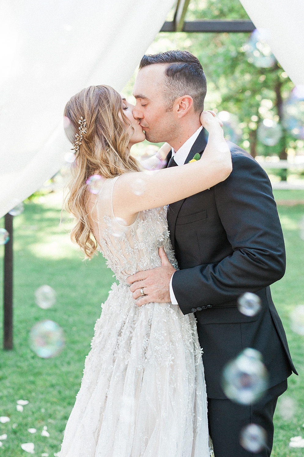 Chandler Hill Vineyards | ST. LOUIS JEWISH WEDDING TRADITIONS: CEREMONY | St. Louis Wedding Photographer | bride and groom holding one another and bubbles